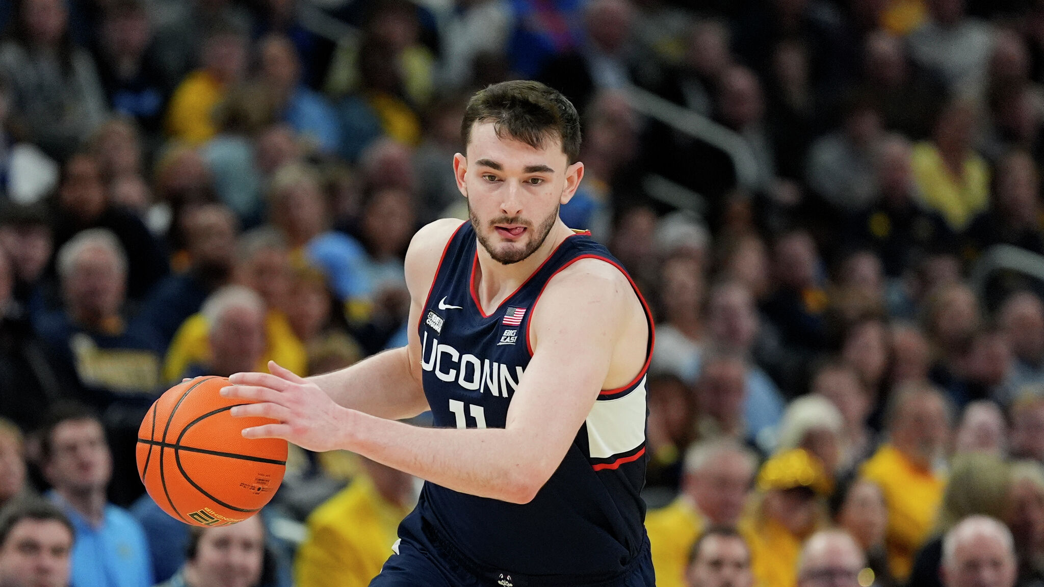 Alex Karaban choosing UConn over the NBA Draft, a momentous decision for both his career and the team's future.
